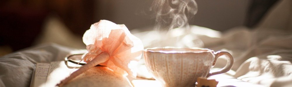 pen, book and tea cup