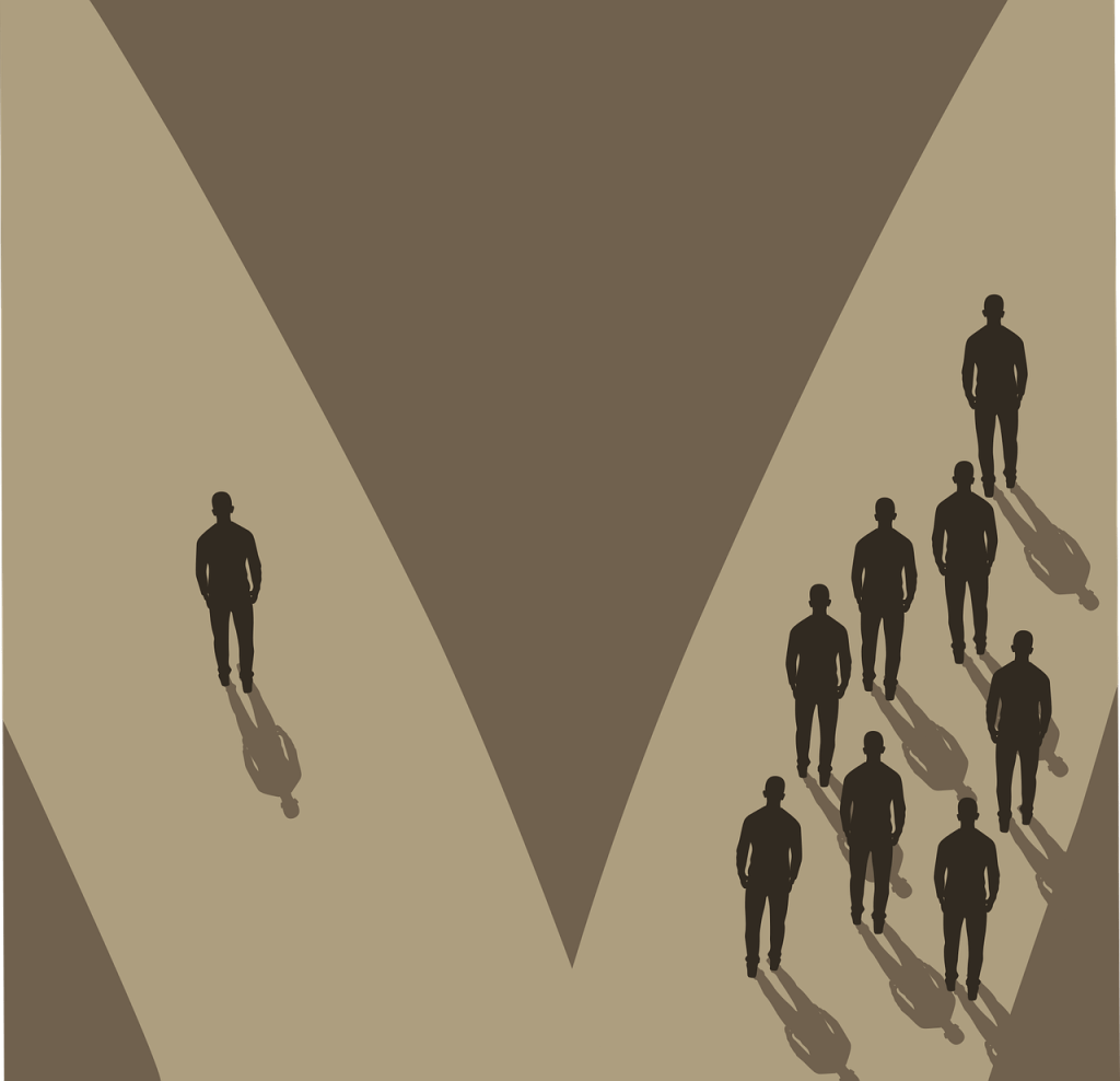 group of men with one man standing alone